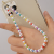 Perla sintética pasante de 6mm blanco marfil dorado para bisuter 6